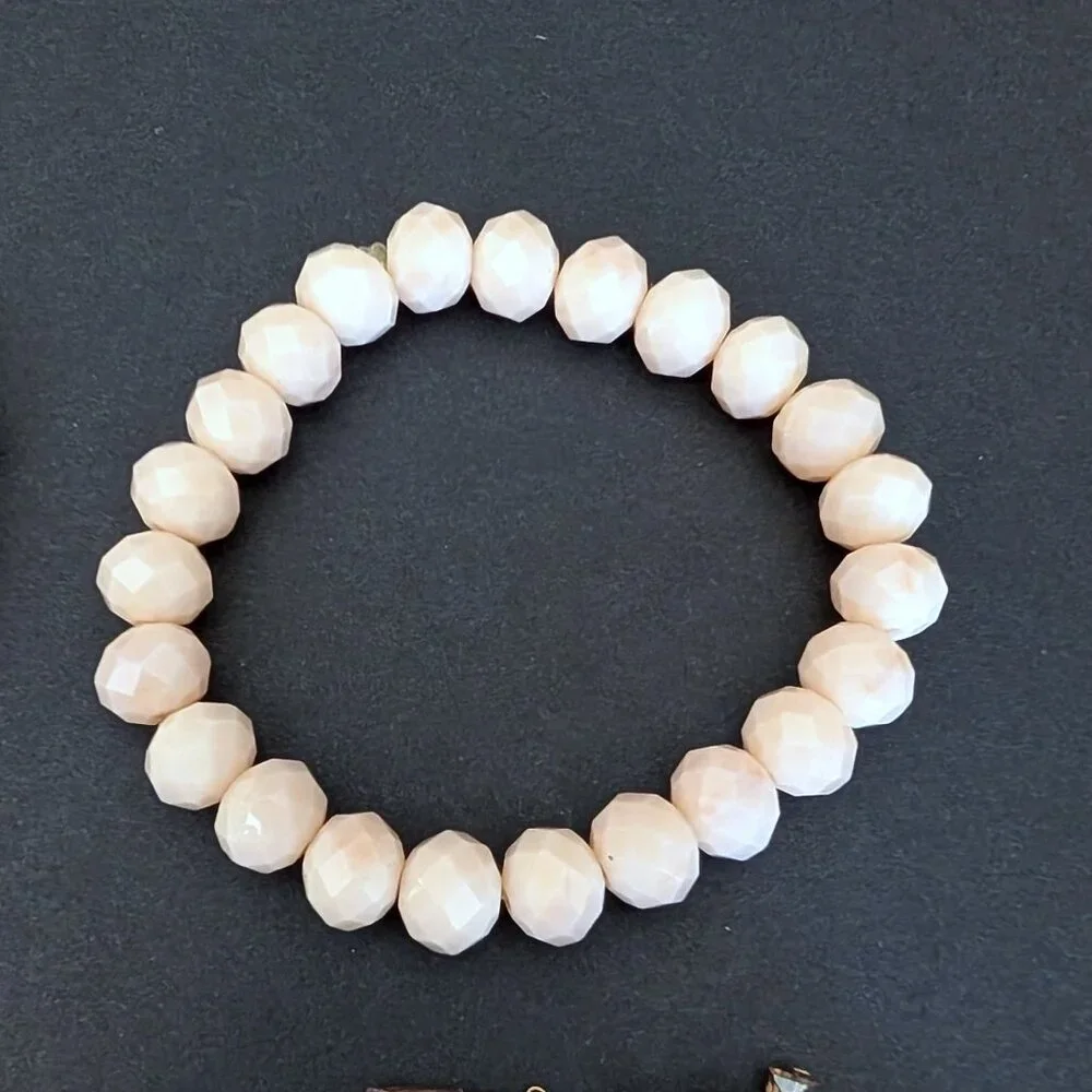 Bundle of nude and natural beaded stretch bracelets